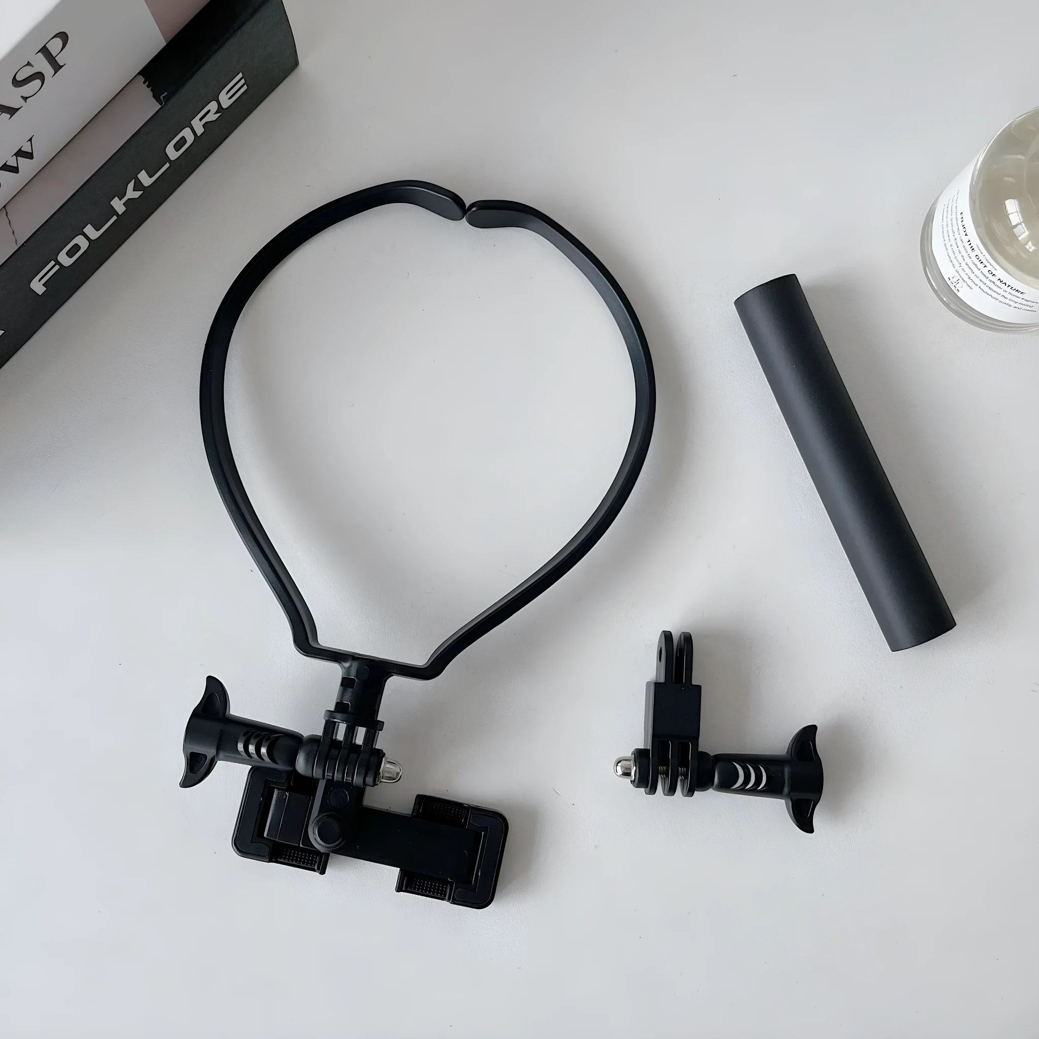 Black plastic cell phone neck hanging bracket with anti slip cushion and extension for horizontal vertical shooting
