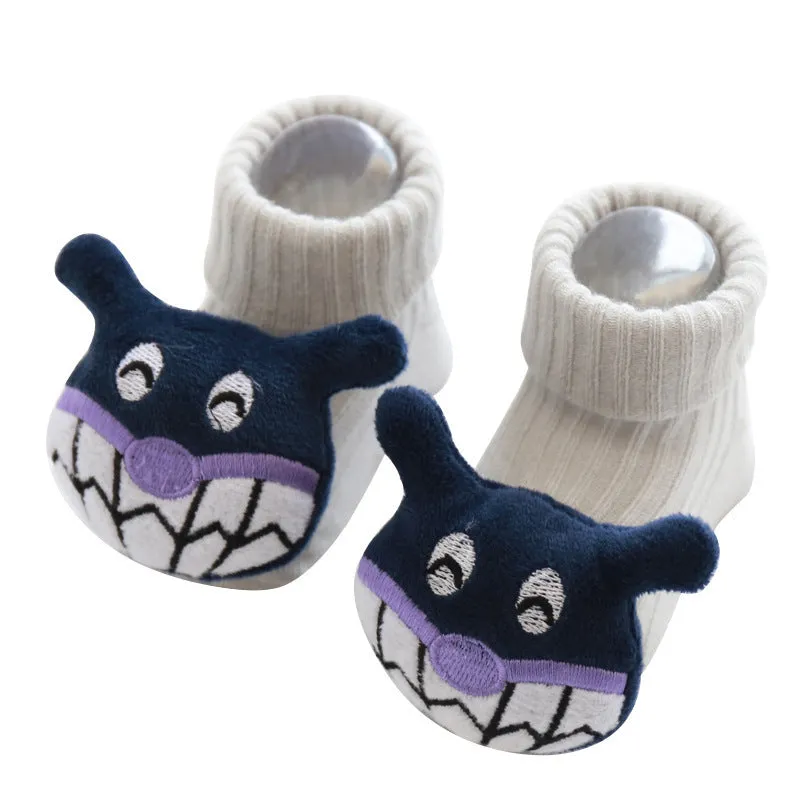 Cotton baby floor socks in various colours and patterns including pink bows, grey stars, and panda design.