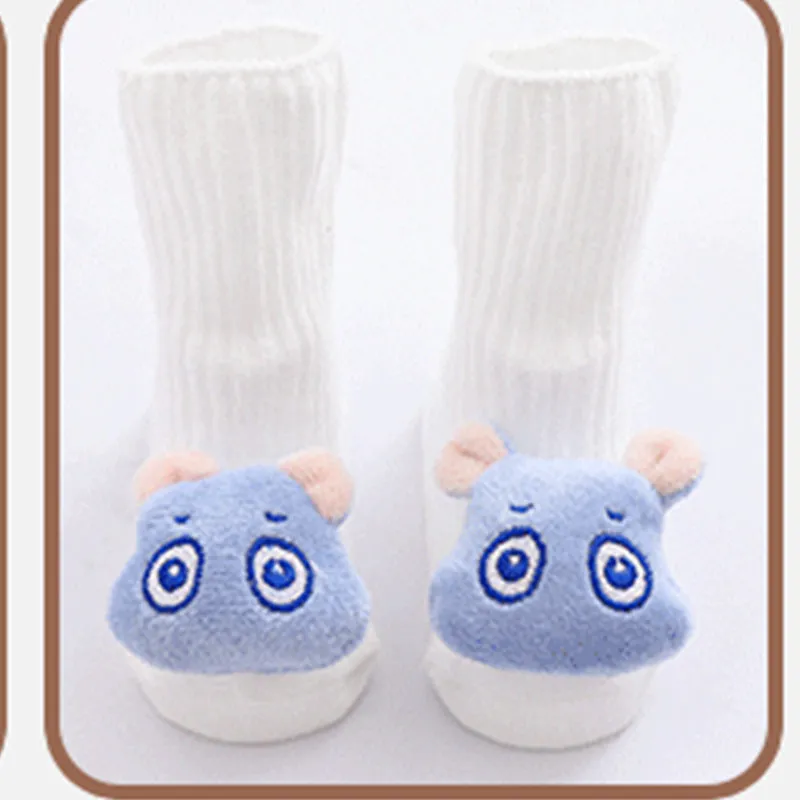 Cotton baby floor socks in various colours and patterns including pink bows, grey stars, and panda design.
