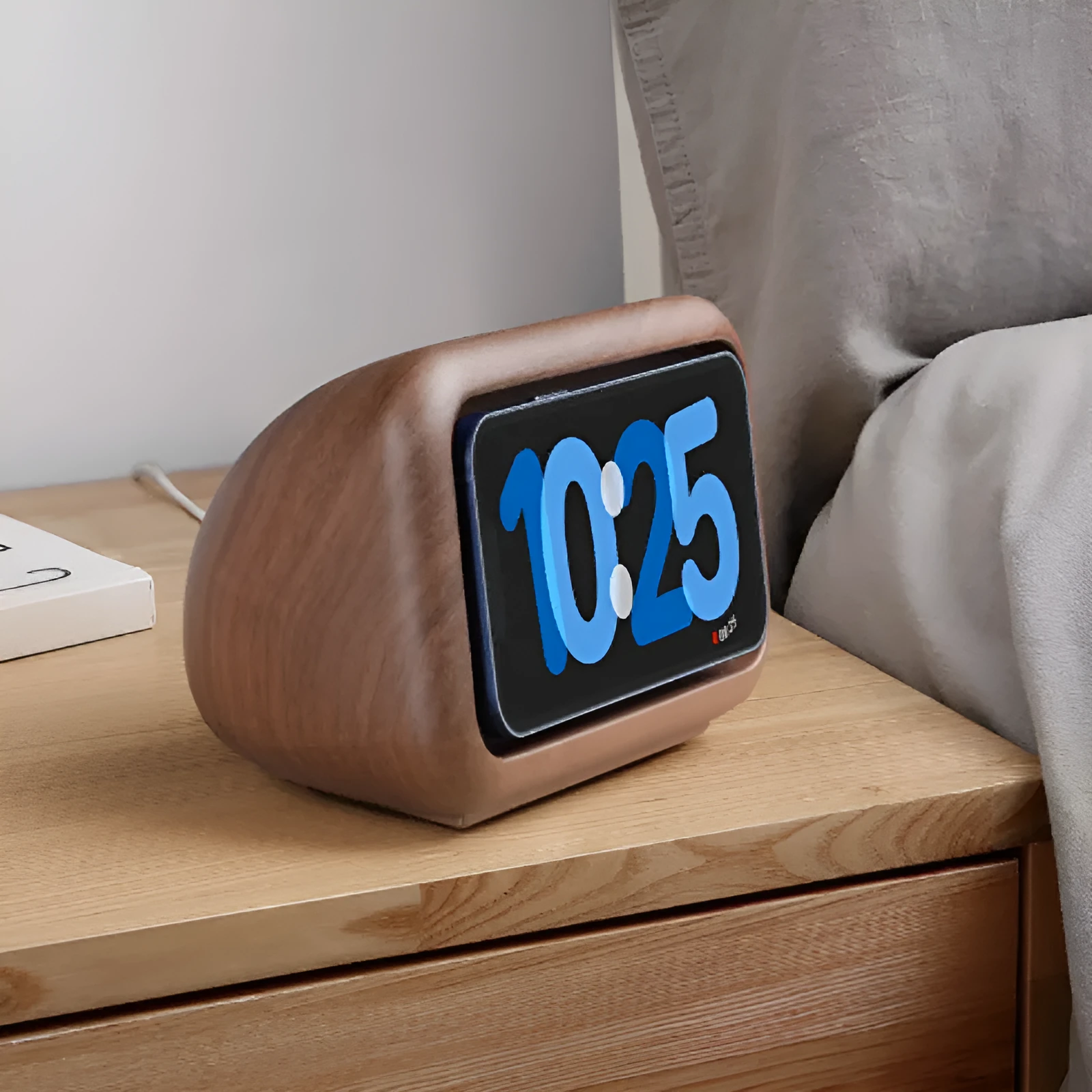 Magnetic wireless charging phone holder stand with alarm clock in white, small size, on a wooden desktop