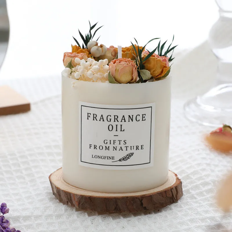 Decorative dried flower scented candle with choice of nine aromas on a wooden chip base.