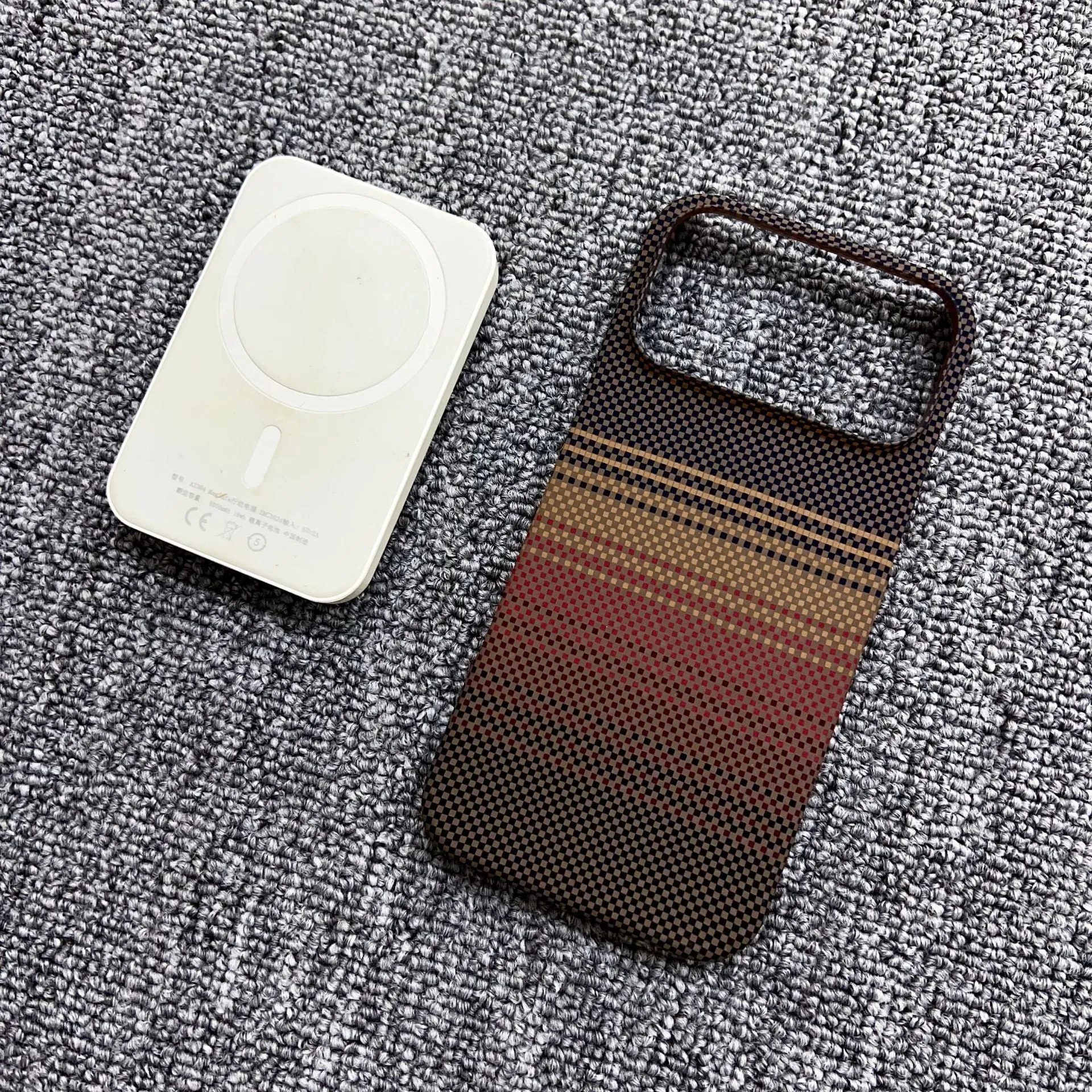 Carbon fiber kevlar magnetic gradient phone case for iPhone 17 Pro Max with plaid pattern in Sunset Gold.