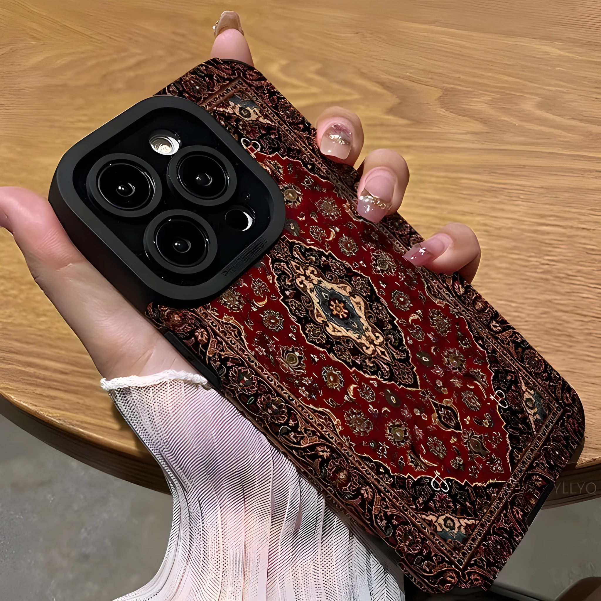Yellow imitation leather phone case with embossed Persian carpet pattern and attached lanyard, viewed from the back