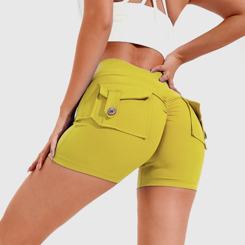 Women's high waist hip lifting shorts in avocado green with side pockets during yoga pose