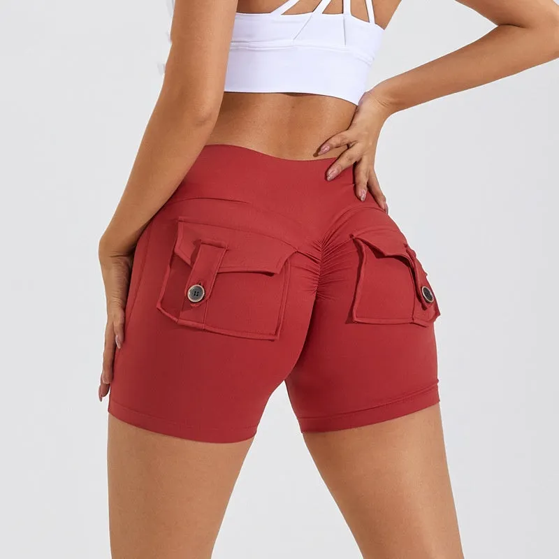 Women's high waist hip lifting shorts in avocado green with side pockets during yoga pose