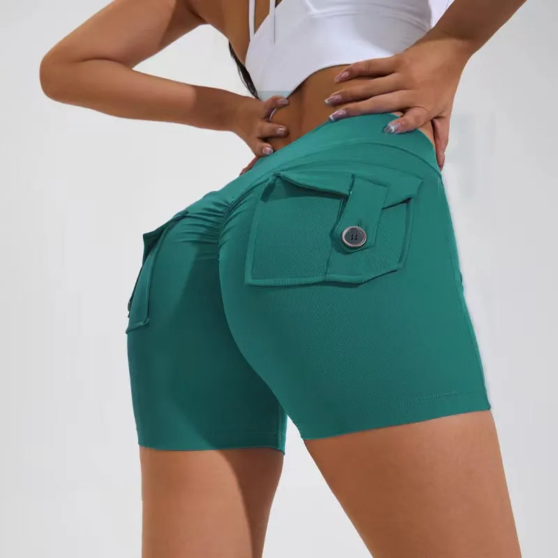 Women's high waist hip lifting shorts in avocado green with side pockets during yoga pose