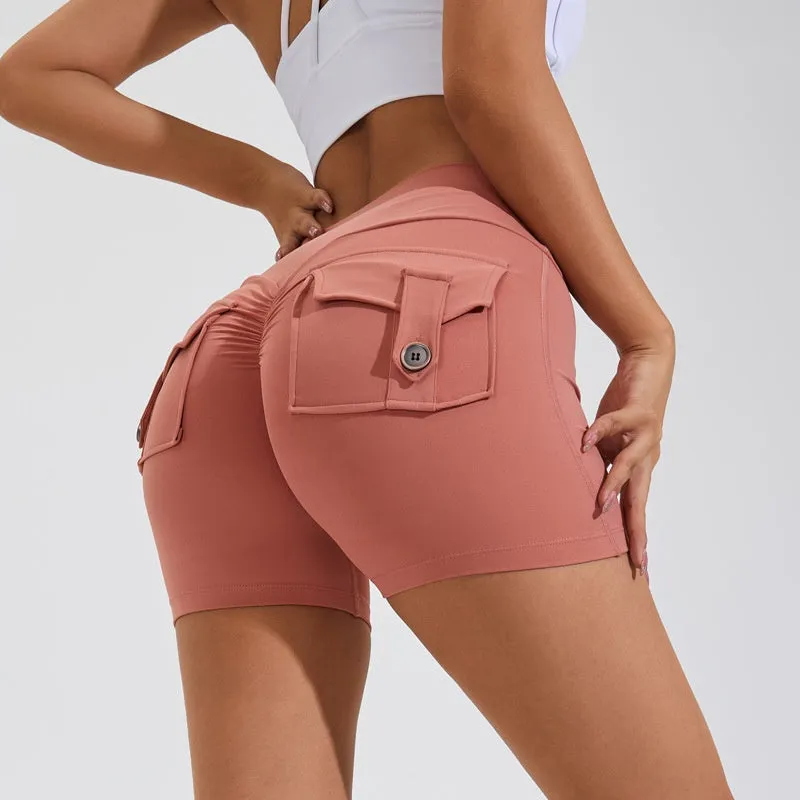 Women's high waist hip lifting shorts in avocado green with side pockets during yoga pose