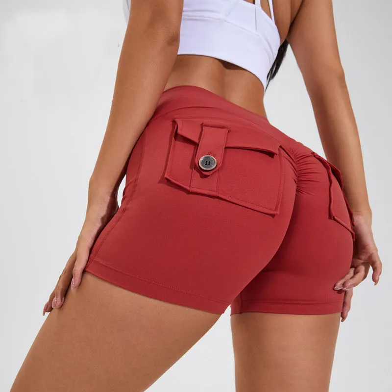 Women's high waist hip lifting shorts in avocado green with side pockets during yoga pose
