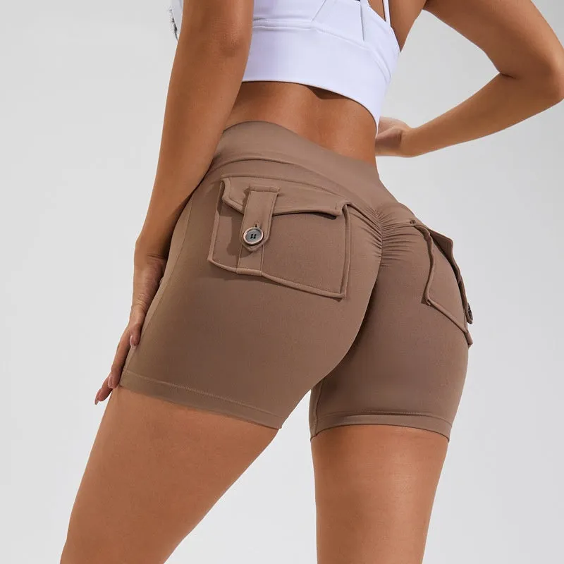 Women's high waist hip lifting shorts in avocado green with side pockets during yoga pose