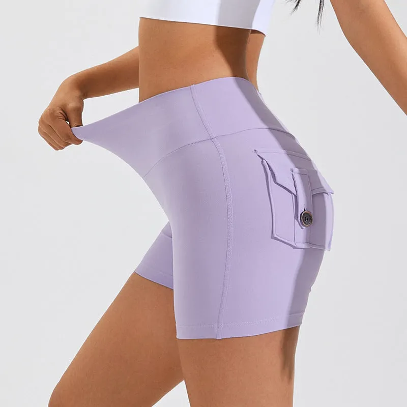 Women's high waist hip lifting shorts in avocado green with side pockets during yoga pose