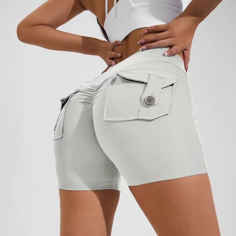 Women's high waist hip lifting shorts in avocado green with side pockets during yoga pose