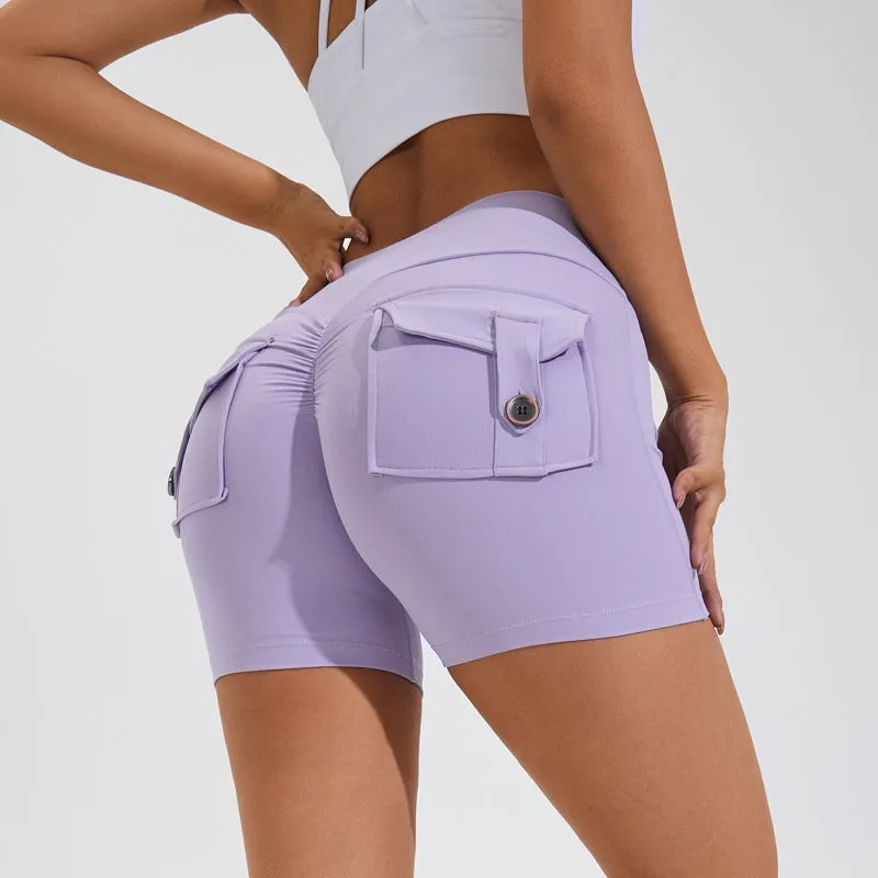 Women's high waist hip lifting shorts in avocado green with side pockets during yoga pose