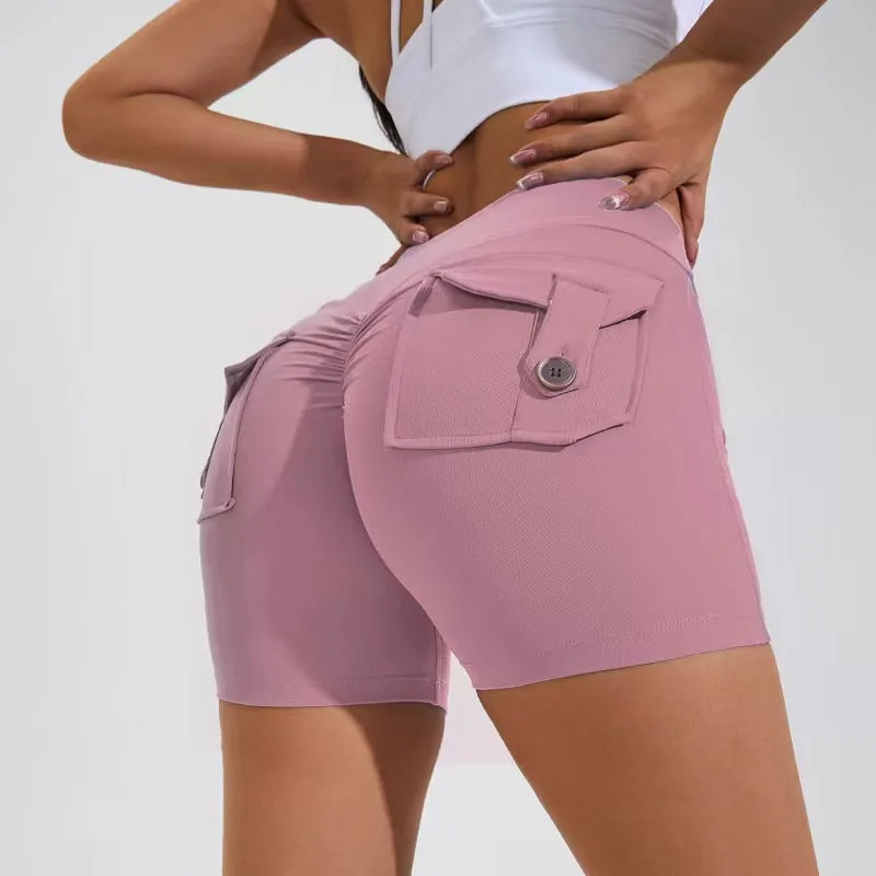 Women's high waist hip lifting shorts in avocado green with side pockets during yoga pose