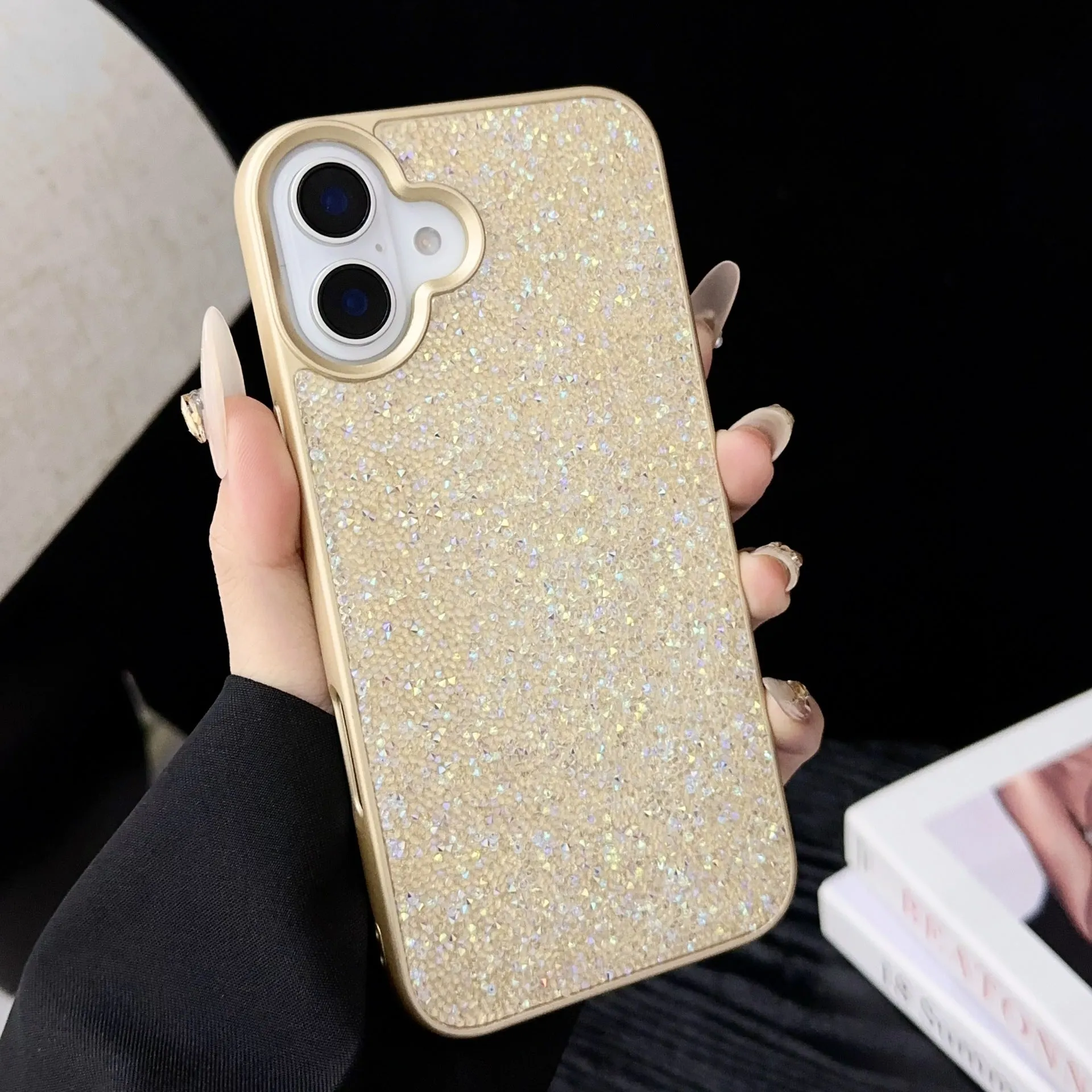 Skin Feeling Carbink phone case for iPhone 14 Pro with large hole cutouts and handmade rhinestone decorations in white, black, and pink colours