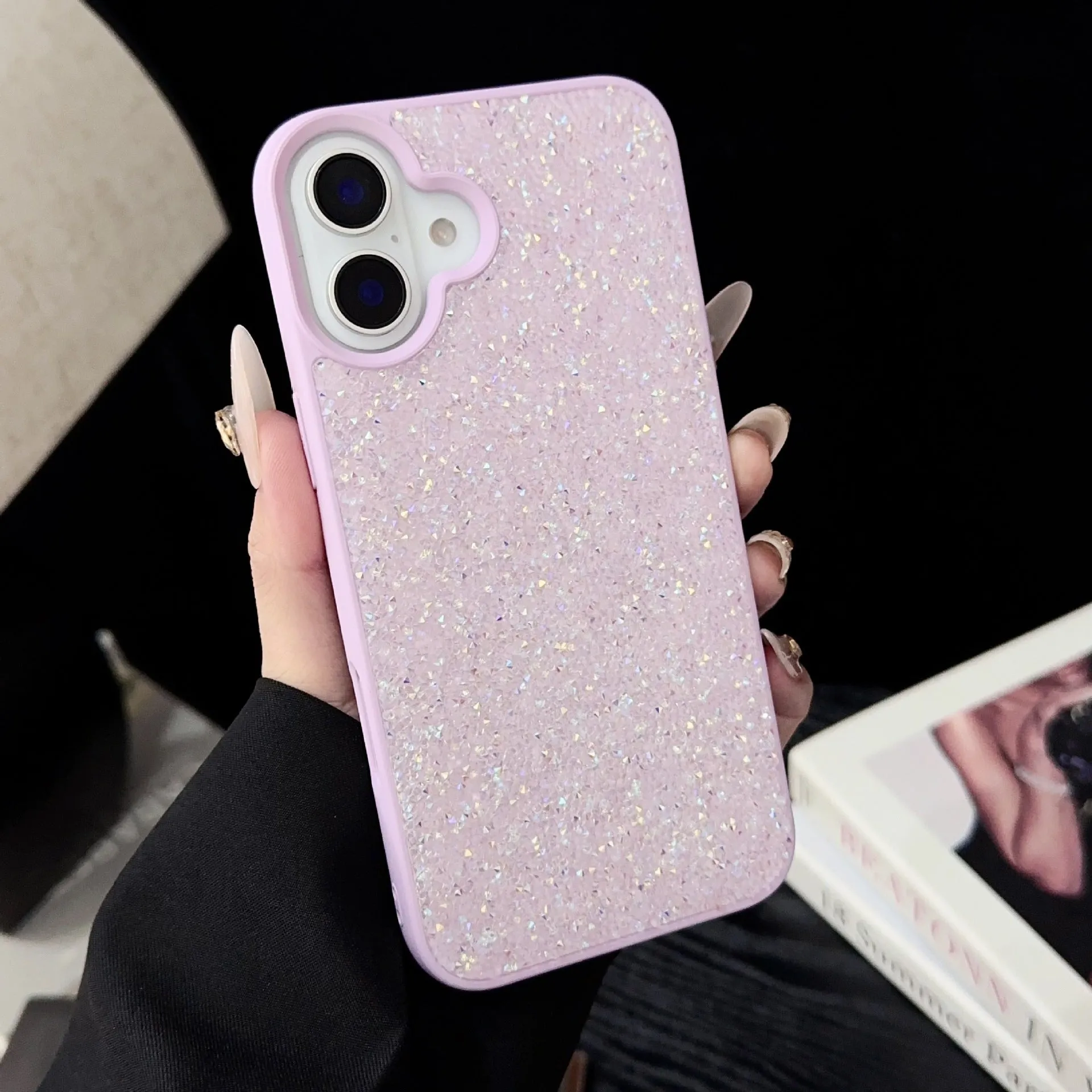 Skin Feeling Carbink phone case for iPhone 14 Pro with large hole cutouts and handmade rhinestone decorations in white, black, and pink colours