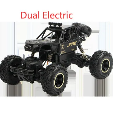 Black and silver remote control off-road car on rough terrain showing four-wheel drive and climbing capability.
