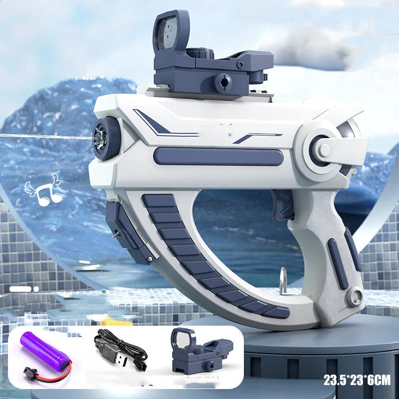 Blue electric water gun toy with USB charging cable on a sandy beach