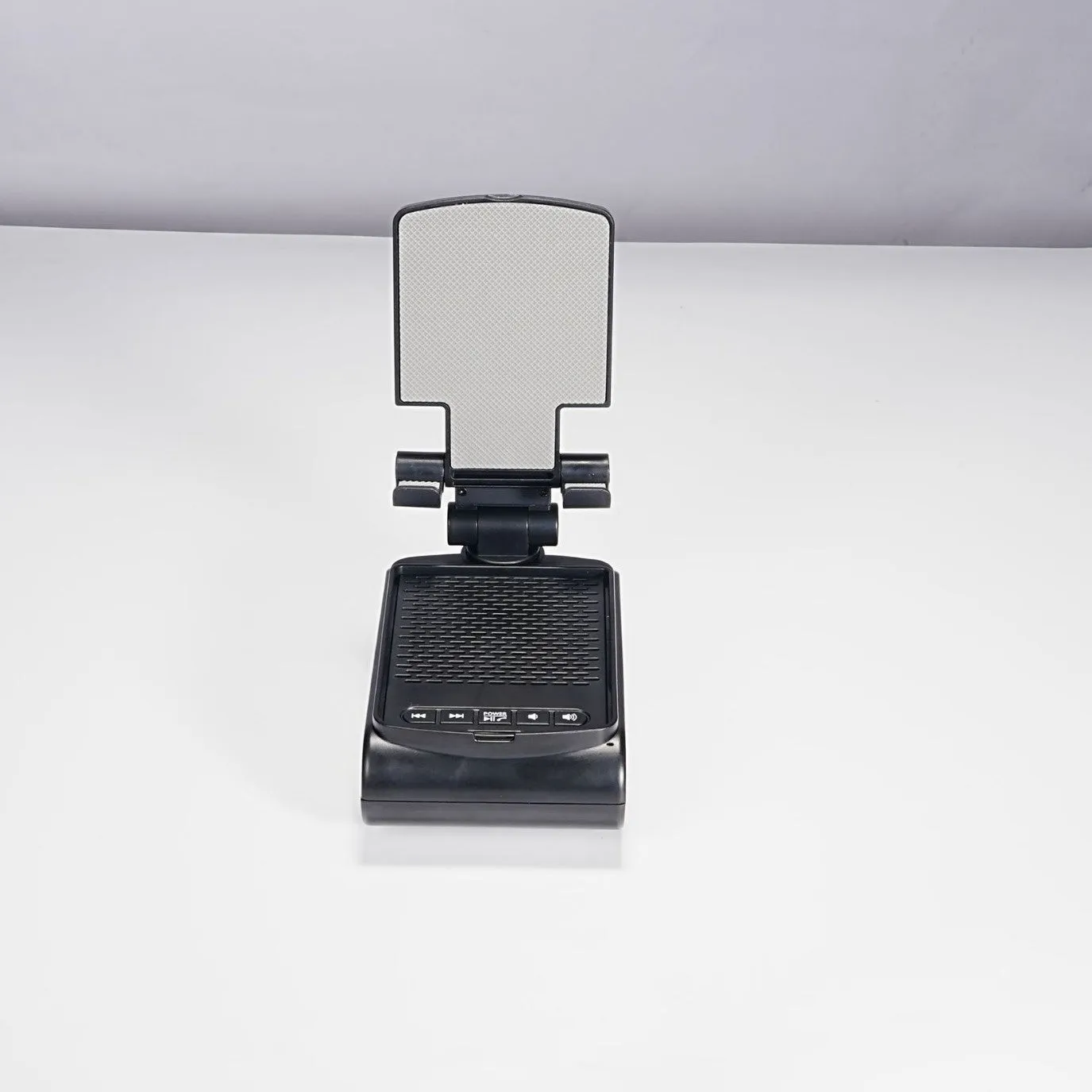 Multi-function lazy phone holder with Bluetooth speaker USB powered black white plastic
