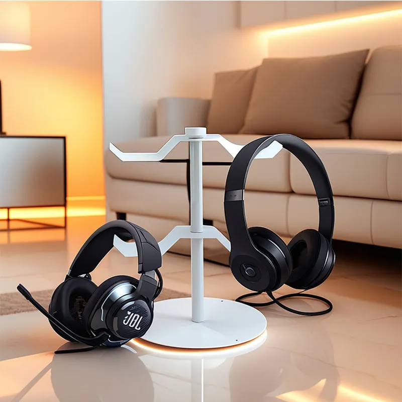 Black two-layer metal headphone bracket holding gaming headsets on a desk
