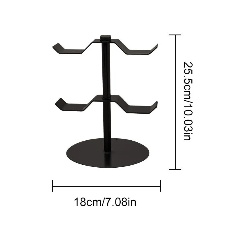 Black two-layer metal headphone bracket holding gaming headsets on a desk