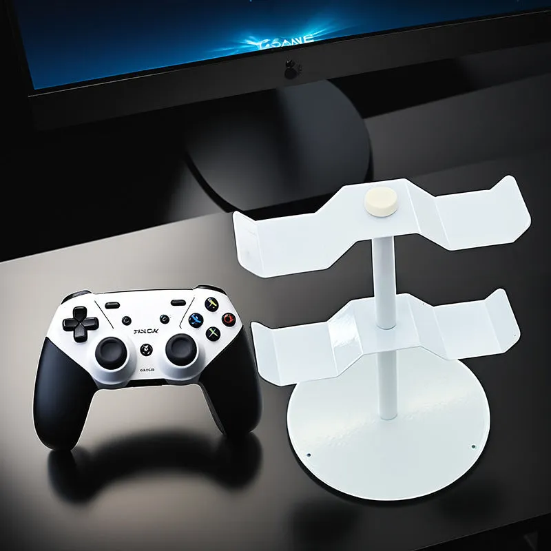 Black two-layer metal headphone bracket holding gaming headsets on a desk
