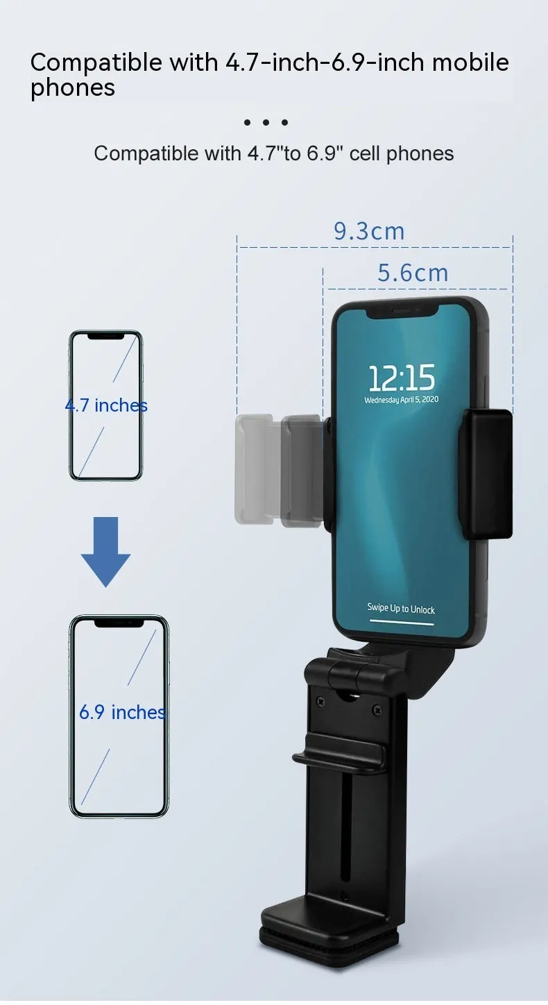 Black foldable ABS phone holder with 360-degree rotation on a desk next to a smartphone