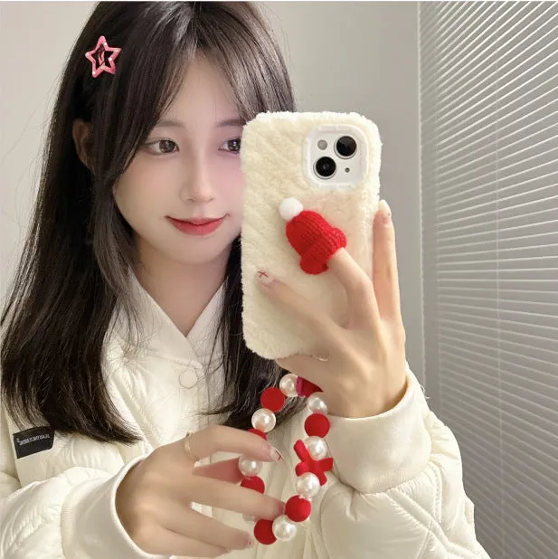 Red silicone phone case with plush Christmas hat bracelet for iPhone on white background
