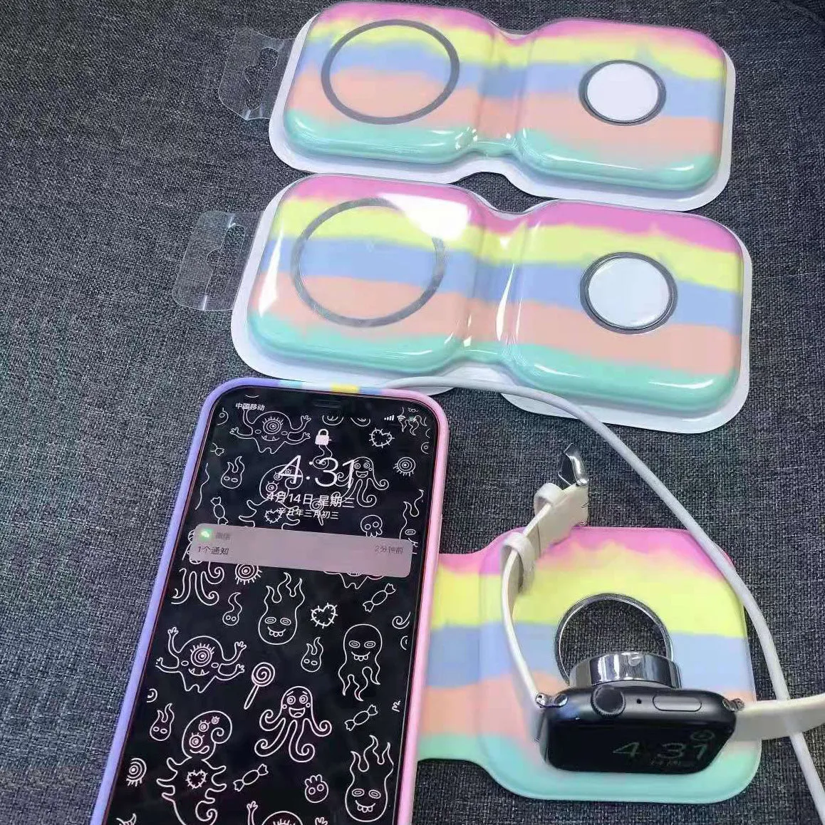 LFX-163 foldable wireless charger in fish-water blue colour charging a mobile phone and watch