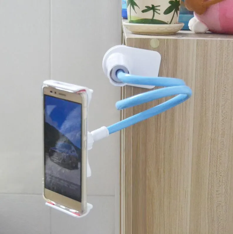 Black bedside oversize phone stand with a long adjustable arm on a wooden table.