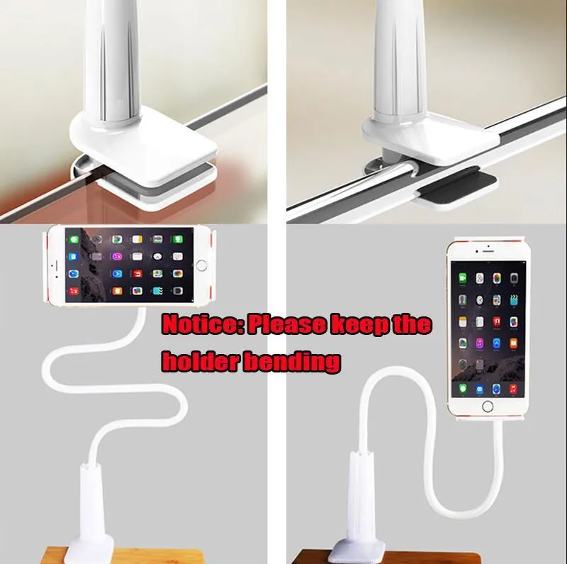 Black bedside oversize phone stand with a long adjustable arm on a wooden table.