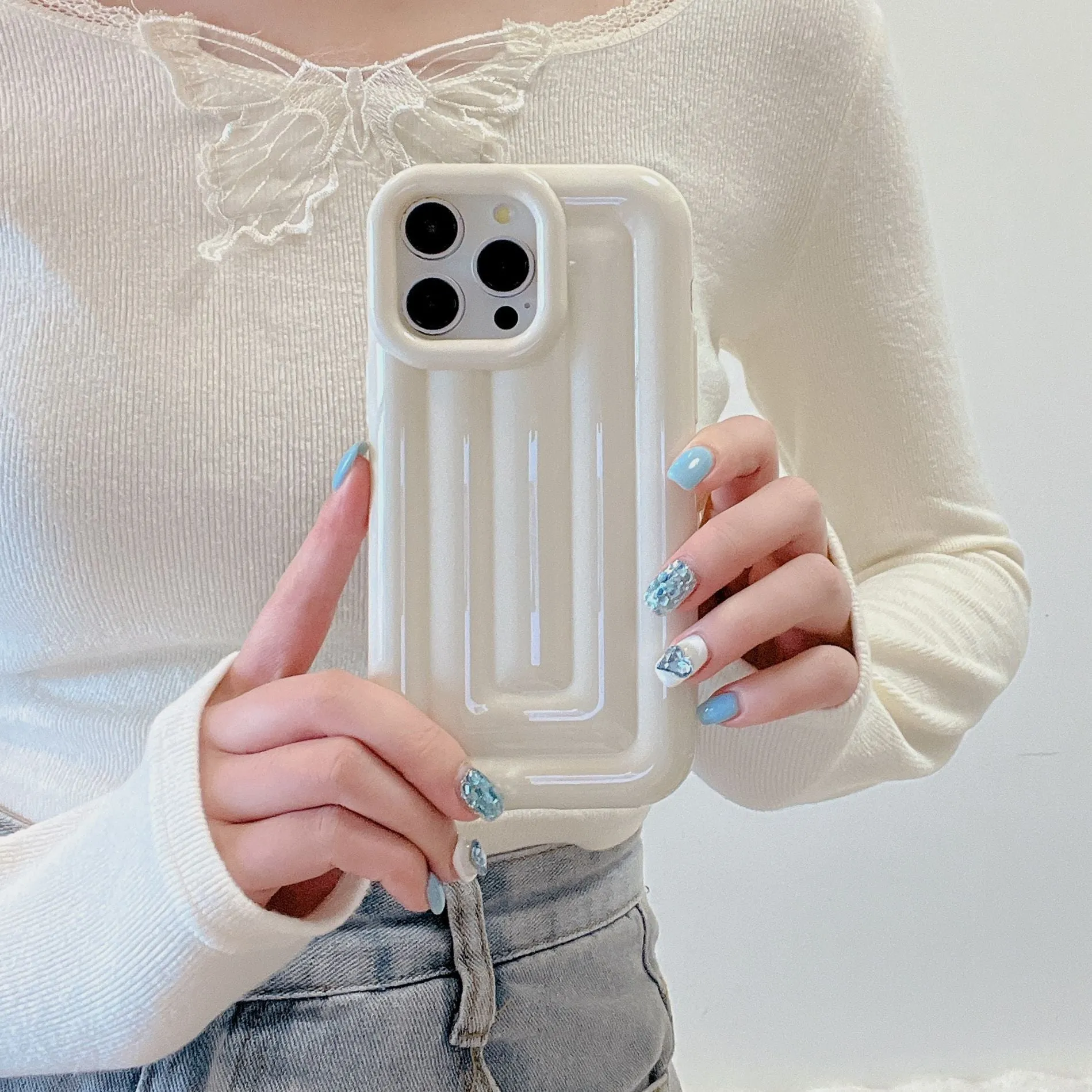 TPU electroplated three-dimensional striped phone case for iPhone 11–14 series in cream white colour