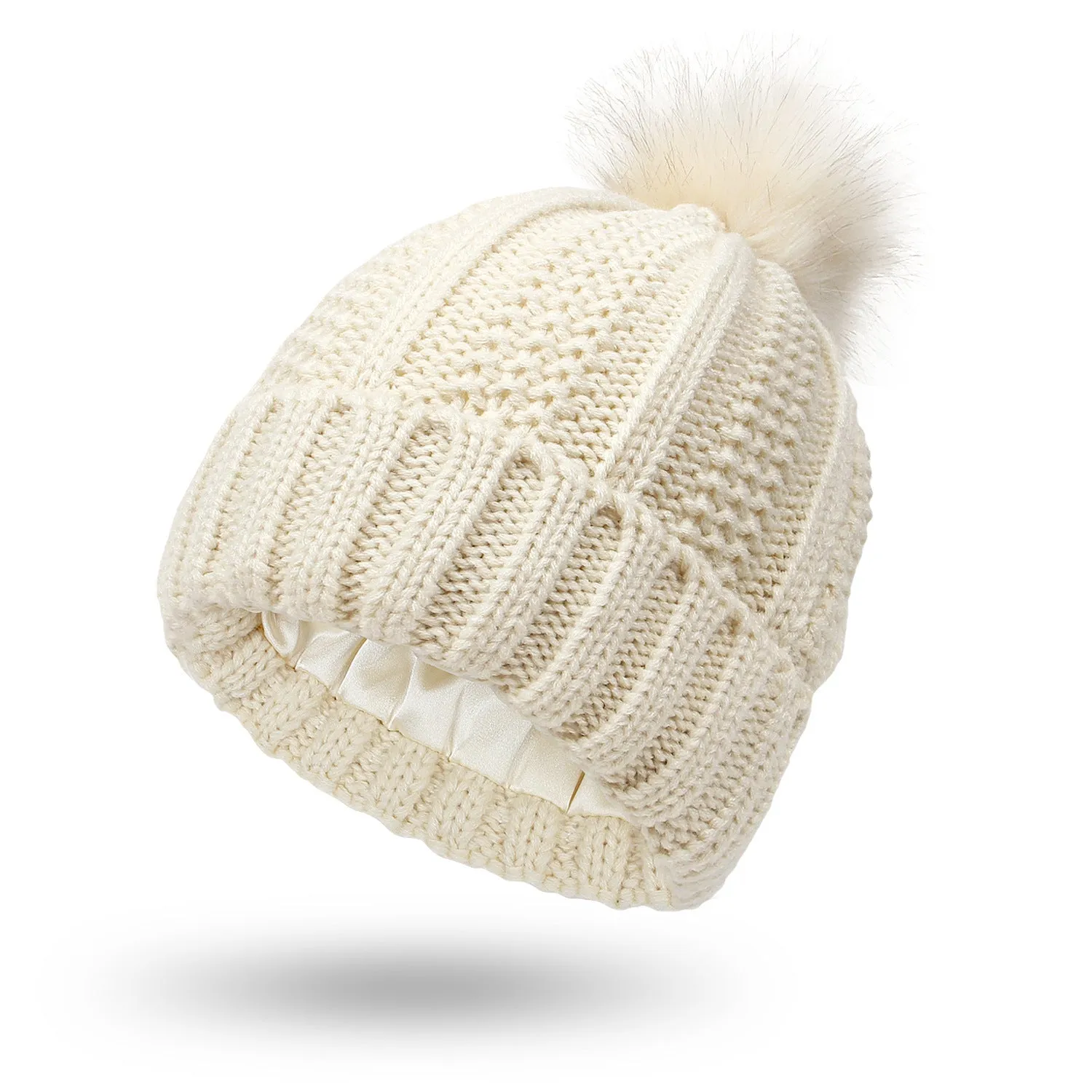 Women's knitted beanie hat with faux fur pom pom and satin lining in multiple colour options.