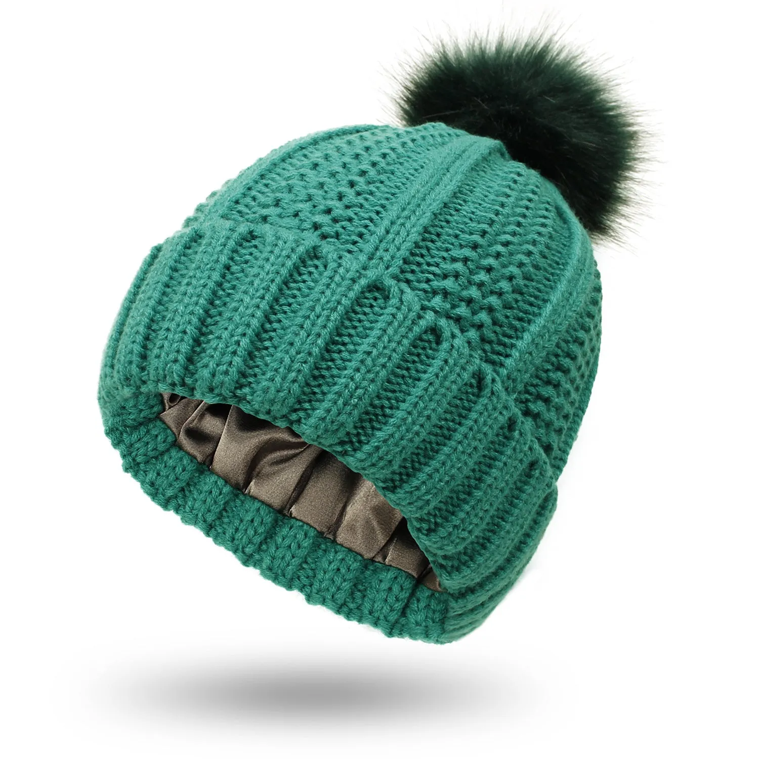 Women's knitted beanie hat with faux fur pom pom and satin lining in multiple colour options.