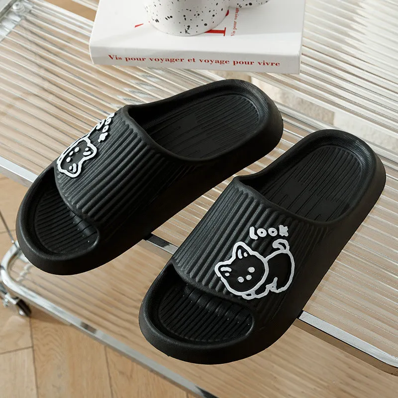 Women's pink EVA cat slippers with thick platform sole on a wooden floor.