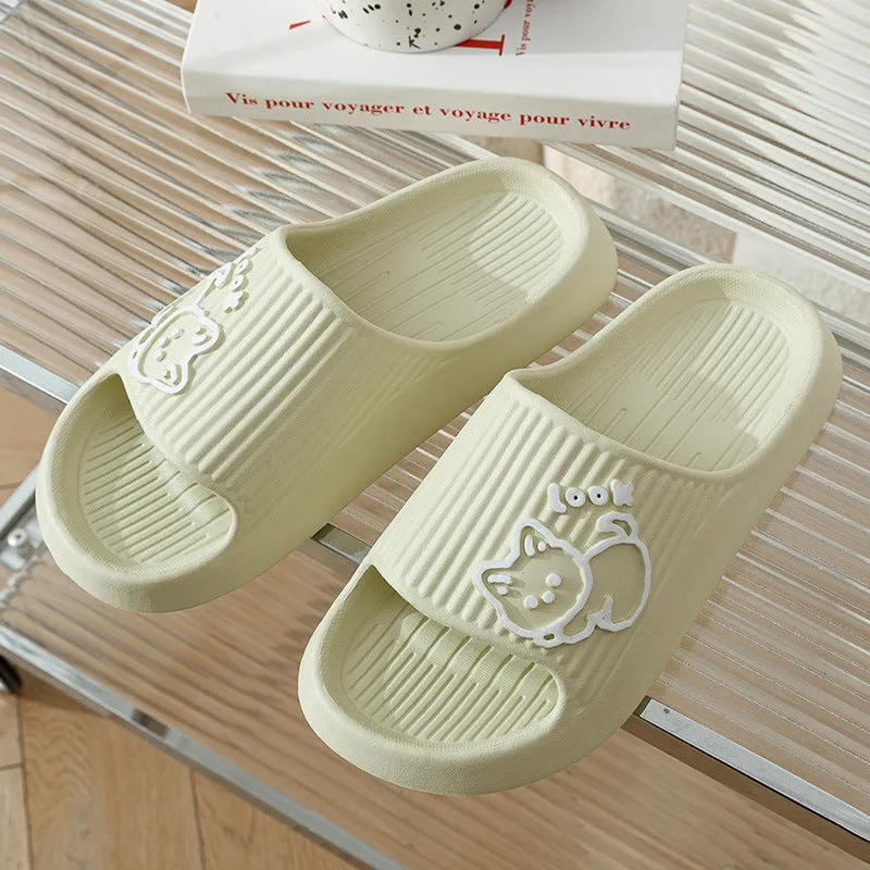 Women's pink EVA cat slippers with thick platform sole on a wooden floor.