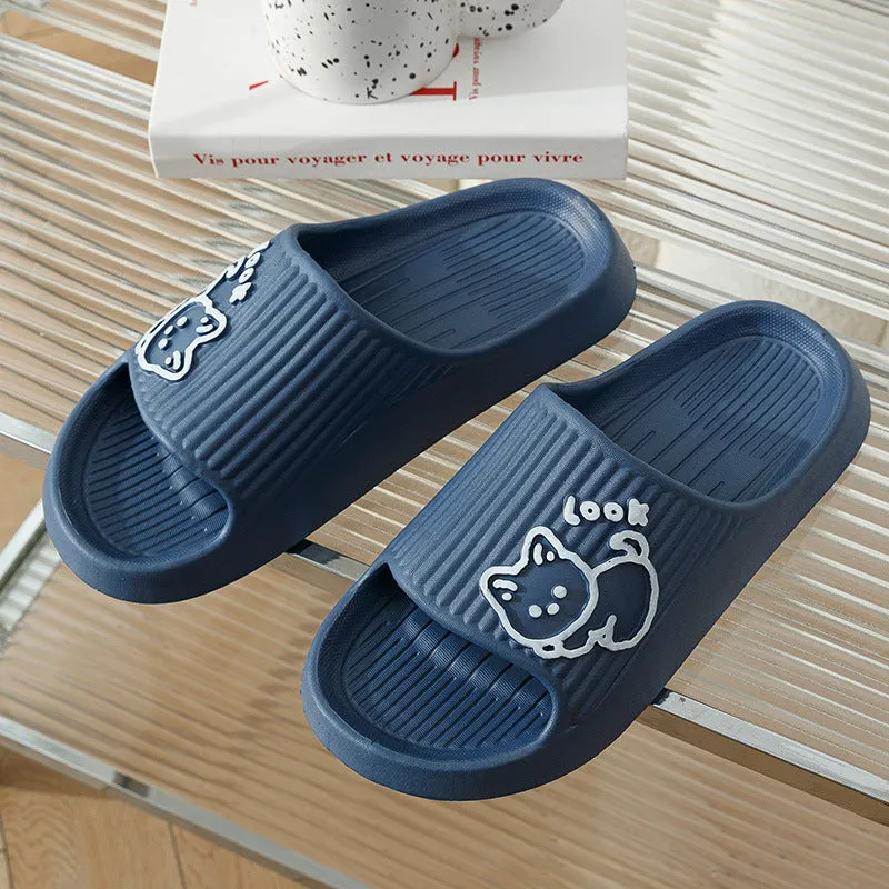 Women's pink EVA cat slippers with thick platform sole on a wooden floor.