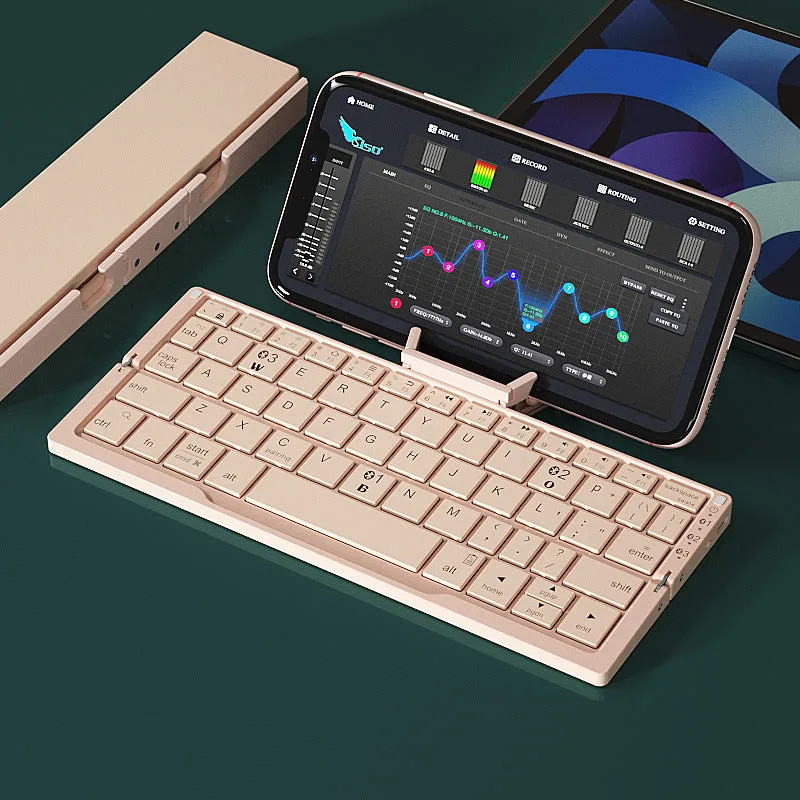 Silver white folding Bluetooth keyboard shown open with stand supporting a smartphone