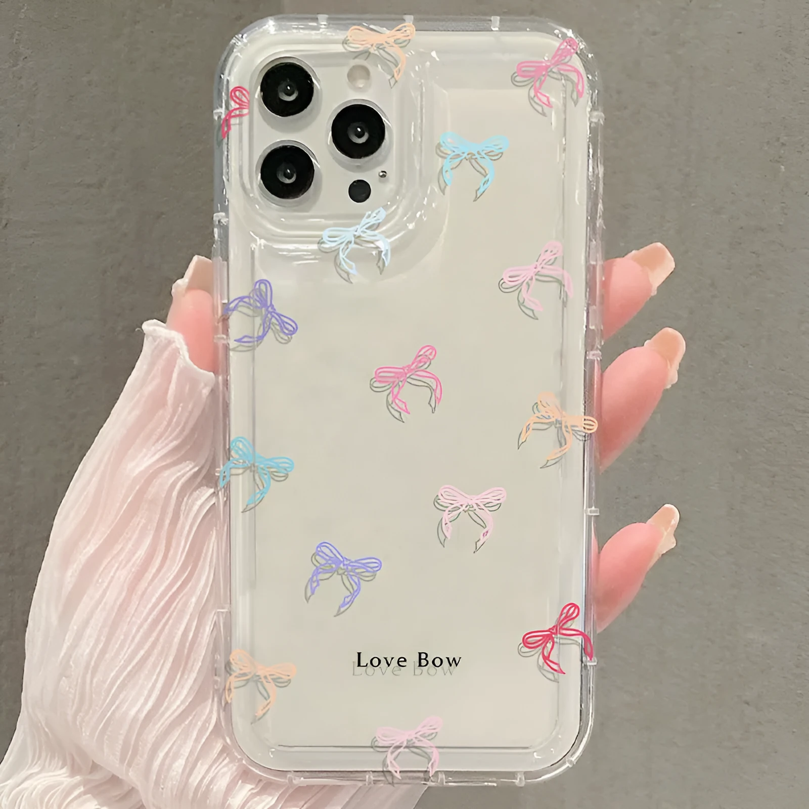 Transparent silicone phone case with bow design and airbag corners for iPhone drop protection