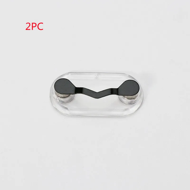Black magnetic glasses holder on a fridge door with spectacles stored
