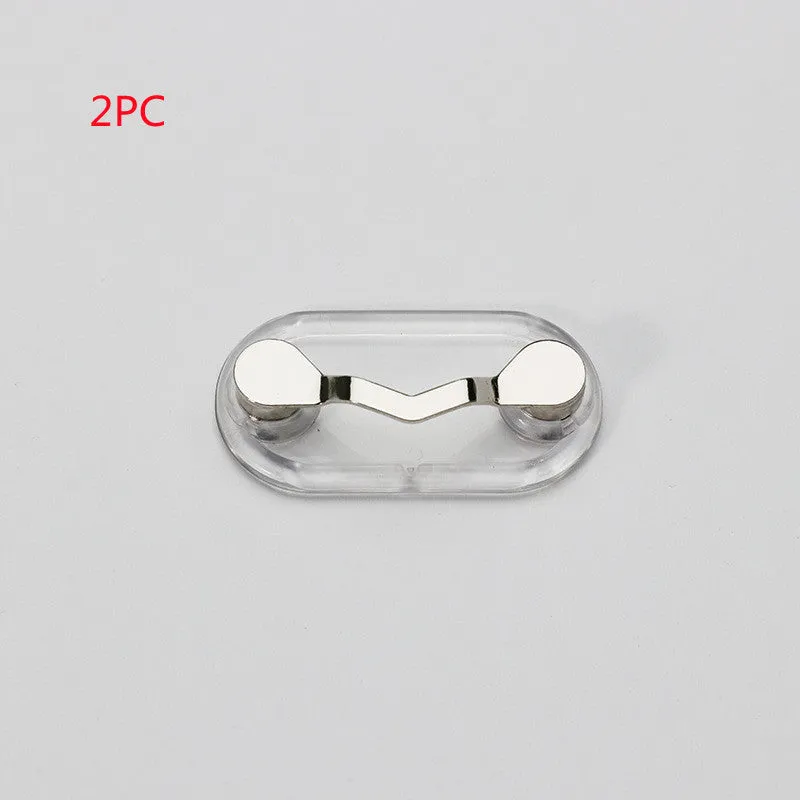 Black magnetic glasses holder on a fridge door with spectacles stored