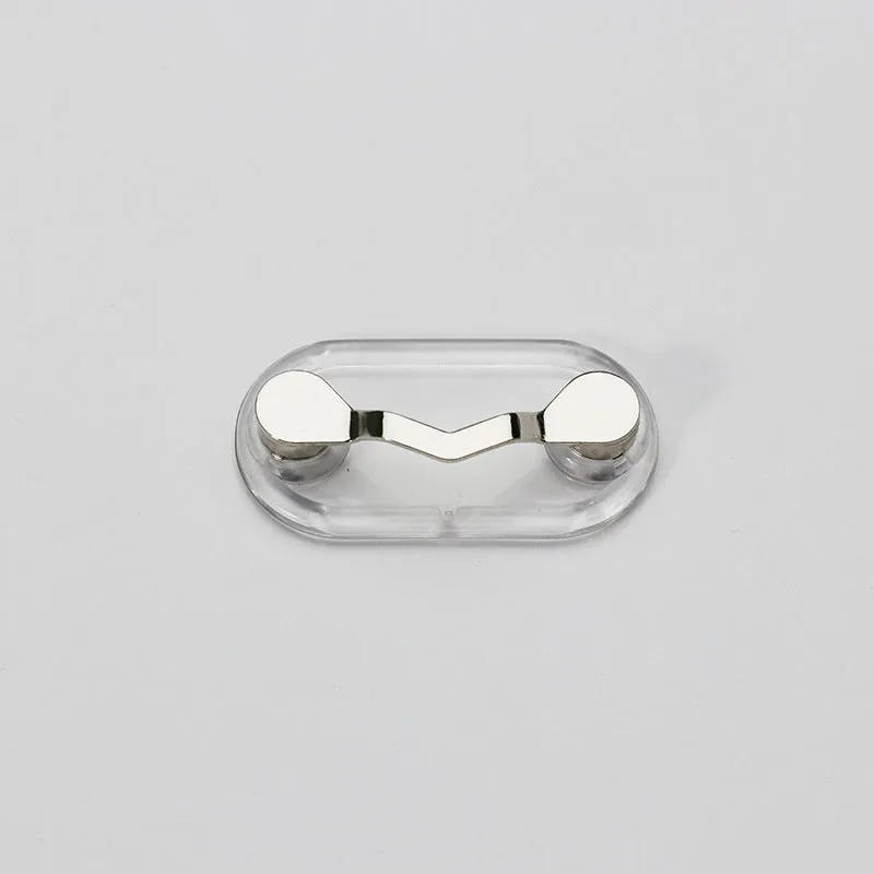 Black magnetic glasses holder on a fridge door with spectacles stored