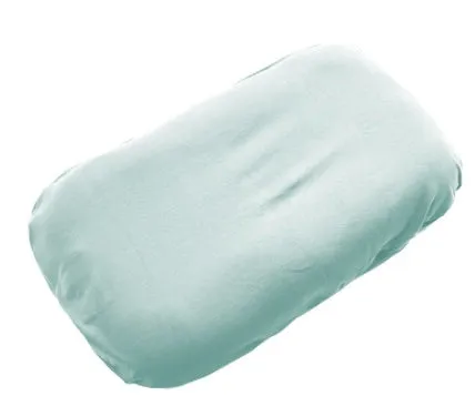 Cotton portable baby nest crib for newborns, beige colour, shown on a bed.