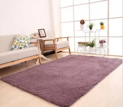 Solid colour plush rectangle carpet with soft velvet pile and non-slip dotted backing.