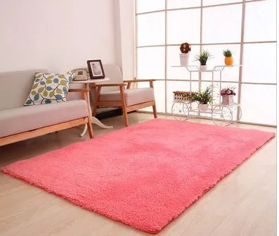 Solid colour plush rectangle carpet with soft velvet pile and non-slip dotted backing.