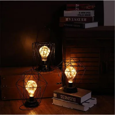 Minimalist hollow wrought iron table lamp with warm white LED light in decorative bottle style