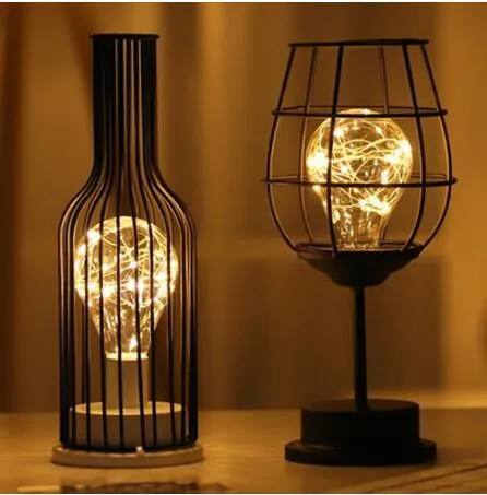 Minimalist hollow wrought iron table lamp with warm white LED light in decorative bottle style