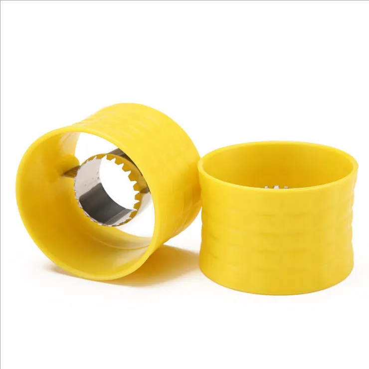 Yellow corn-shaped manual peeler thresher with a stainless steel gear for removing kernels.