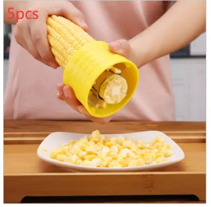 Yellow corn-shaped manual peeler thresher with a stainless steel gear for removing kernels.