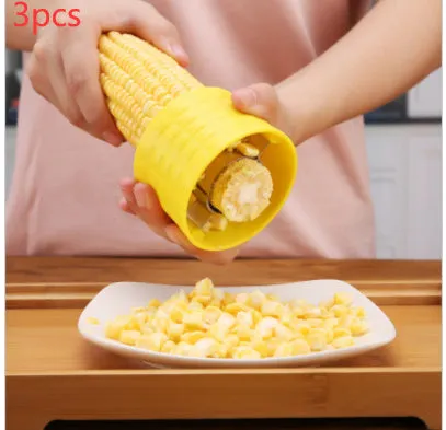 Yellow corn-shaped manual peeler thresher with a stainless steel gear for removing kernels.