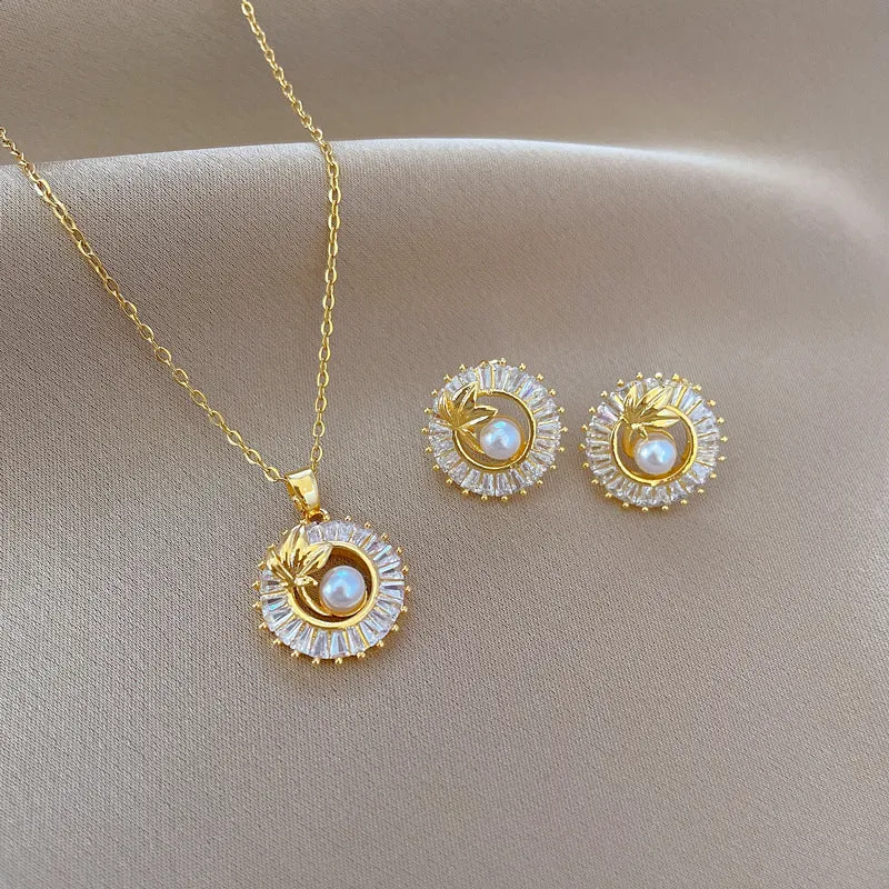 Women's geometric jewellery set with square full diamond motif, leaf design, titanium steel chain, and gold-plated copper pendant and earrings.